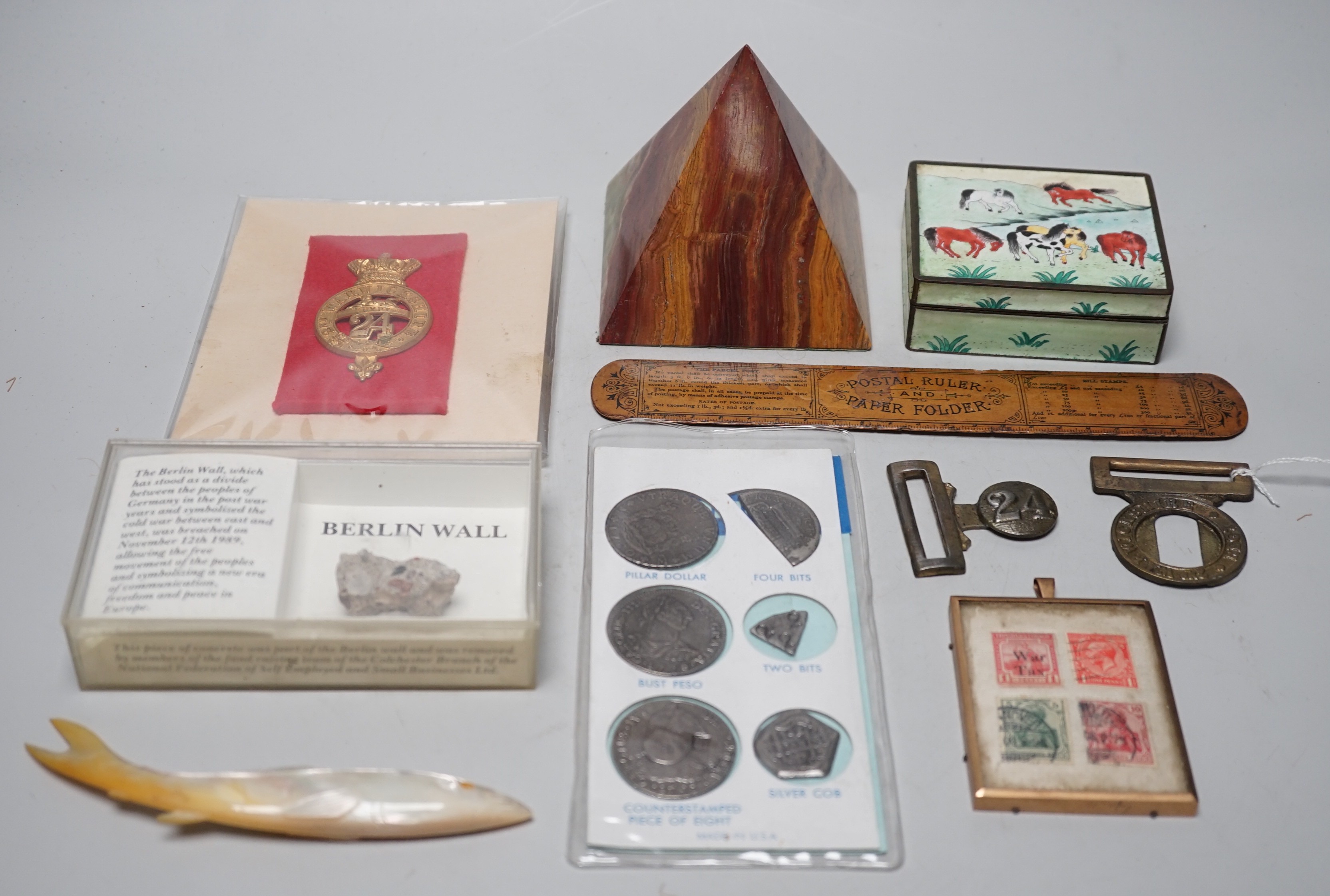 A collection of collectibles: a mother of pearl carves fish, a Mauchlin postal ruler, an enamel box and trays, coinage and various military badges etc